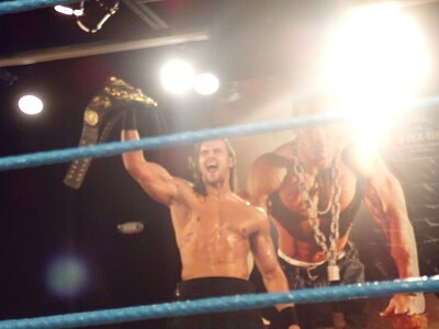 Which championship did Drew McIntyre win in Evolve Wrestling?