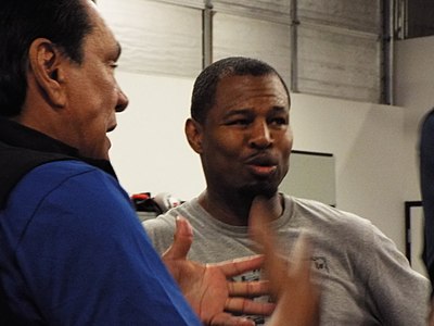 Who awarded Shane Mosley his first professional title?
