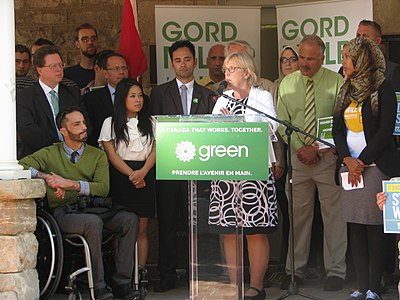In what year did Elizabeth May become the first member of the Green Party to be elected as an MP?