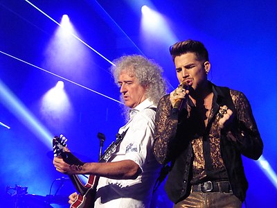 Which award show did Adam Lambert's performance with Queen open in 2019?