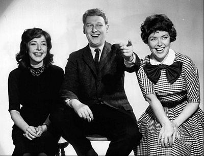 Who was Elaine May's improvisational comedy routines partner?