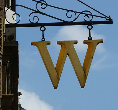 What is the name of Waterstones' own café brand?