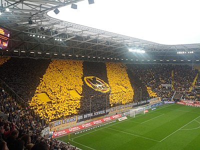 How many seasons did Dynamo Dresden play in the top division, Bundesliga, after the reunification of Germany?