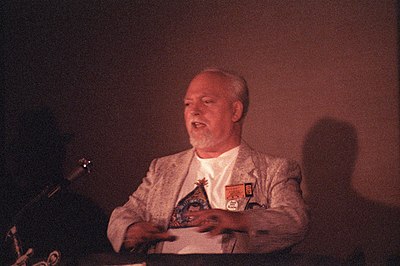 What is one of the main themes in Robert Anton Wilson's non-fiction works?