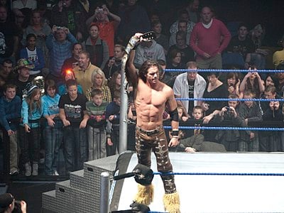 In which year did John Morrison first headline Impact Wrestling's flagship event, Bound for Glory?