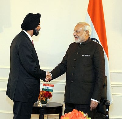 Which organization did Ajay Banga formerly chair, representing over 300 international companies investing in India?