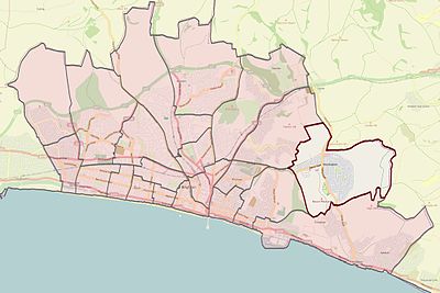 What type of landscape surrounds Brighton and Hove?