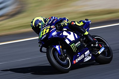 Which number did Valentino Rossi have while playing for [url class="tippy_vc" href="#2550909"]Grand Prix Motorcycle Racing[/url]?