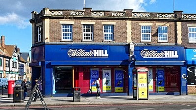 In which country is William Hill's International business hub located?