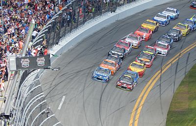 In which country did NASCAR's roots with moonshine runners begin?