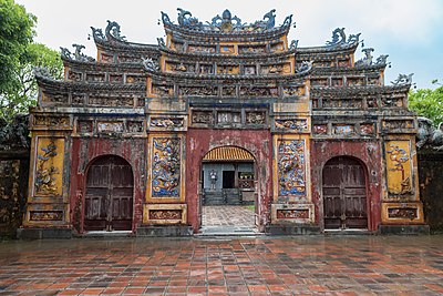 What surrounds the Complex of Huế Monuments?