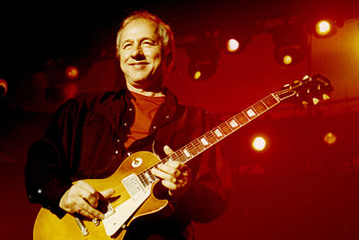 In what year did Dire Straits disband for good?