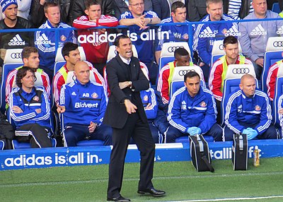 Which team does Poyet currently manage?