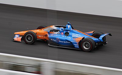 Which team does Scott Dixon race for?
