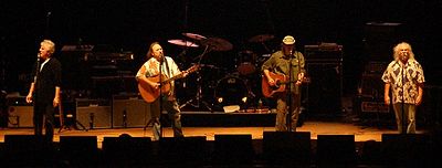 Which instruments does Neil Young play?[br](Select 2 answers)
