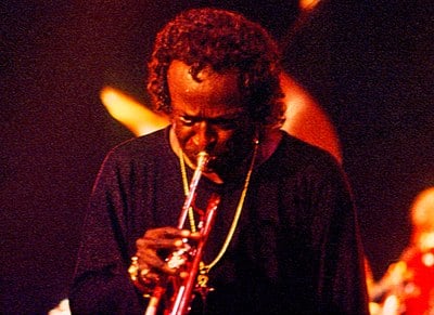 Which album marked the beginning of Miles Davis' electric period?