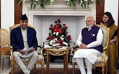 With which country did Deuba oversee a treaty during his first term?