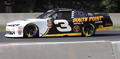 Which class did Brendan Gaughan upgrade to after pickup trucks?